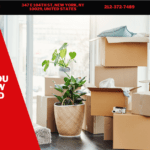 How Do I Choose A Long Distance Moving Company? 5 Moving supplies stacked in a bright room, featuring cardboard boxes, a potted plant, and a wrapped lamp, highlighting essential items for a smooth move. 5 Stars Movers NYC branding visible in the corner.